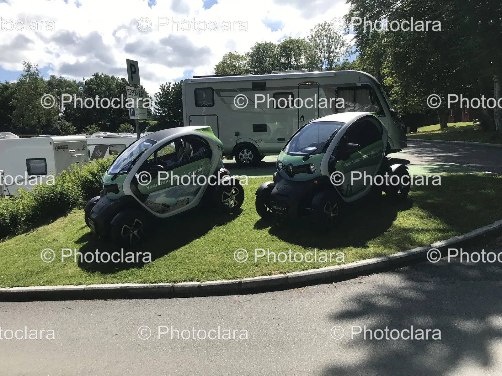 Two-Small-Cars-Parked-on-Grass-Stavanger-Camping.jpg