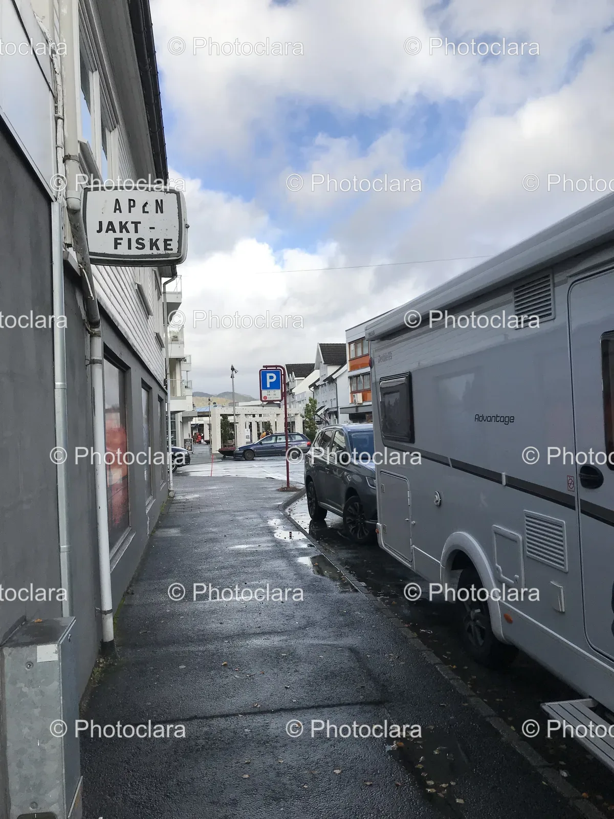 car-parked-by-road-with-sign.jpg