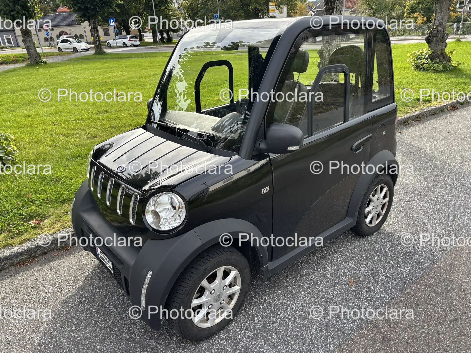 compact-black-car-parked-on-road.jpg