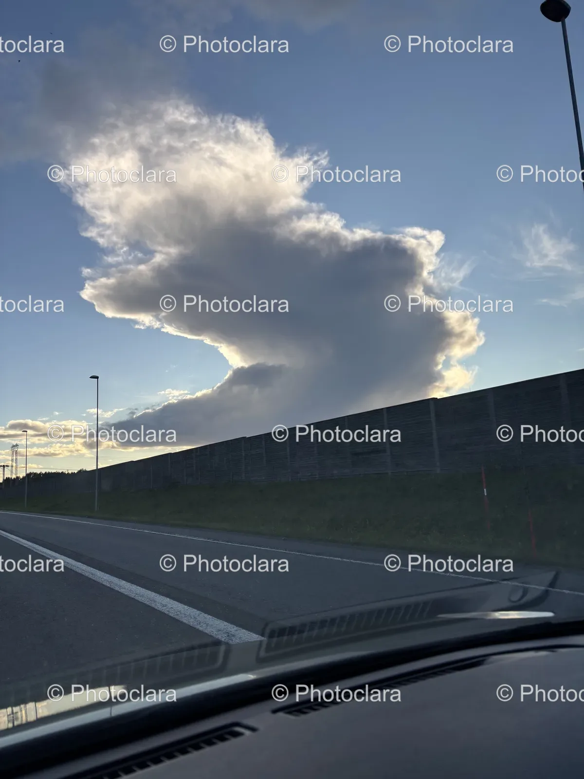 lonely-road-under-puffy-clouds.jpg