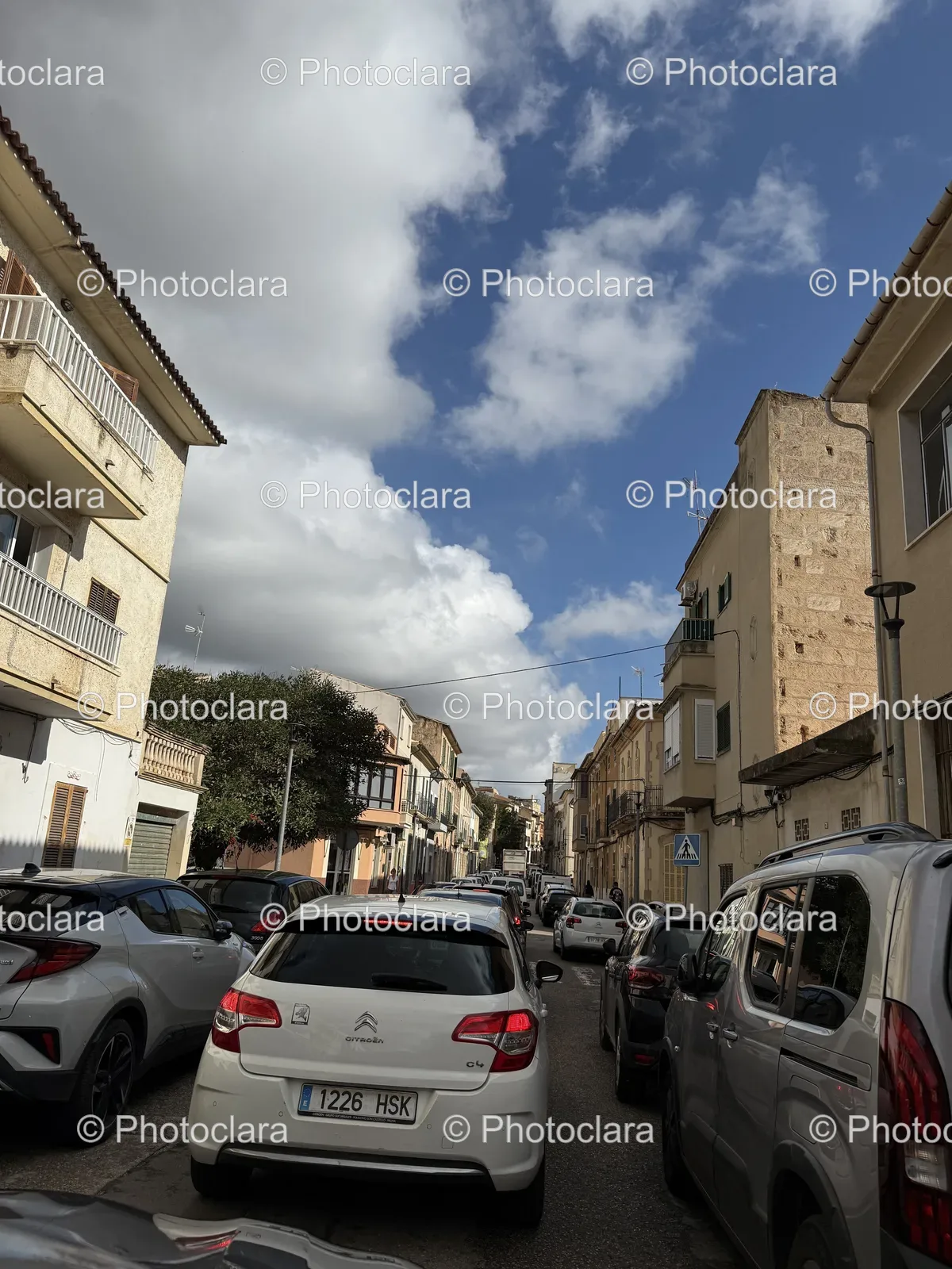 Street-Lined-with-Parked-Cars-in-Urban-Setting.jpg