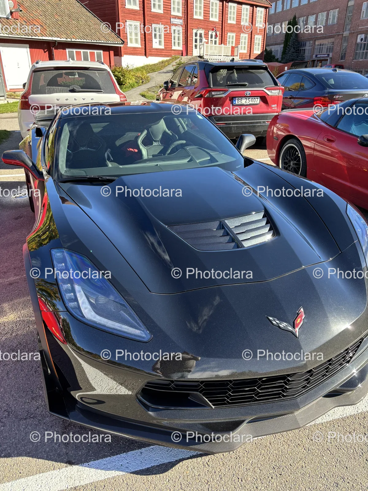 black-sports-car-parking-lot.jpg