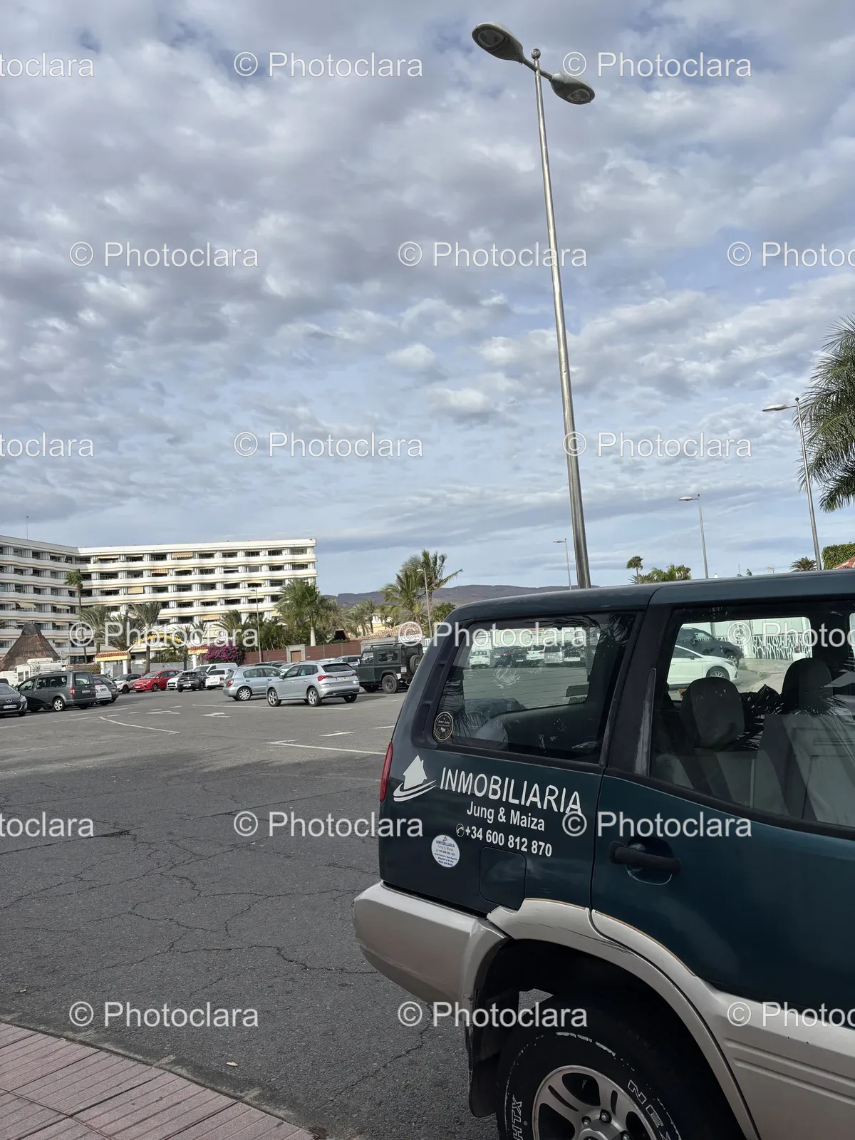 Car-Parked-in-Lot-with-Visible-Signage.jpg