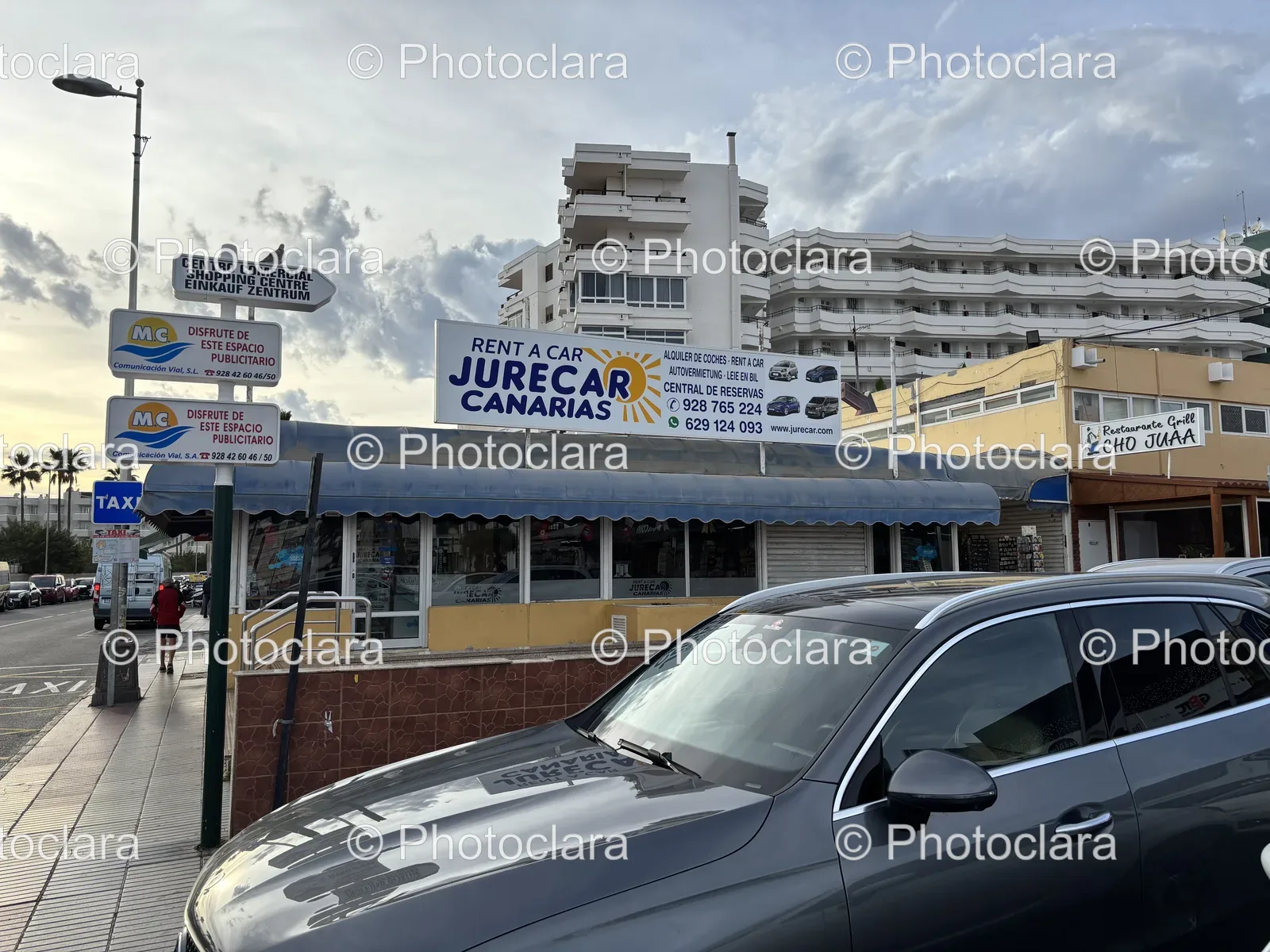 Parked-Car-in-Front-of-Shopping-Center.jpg