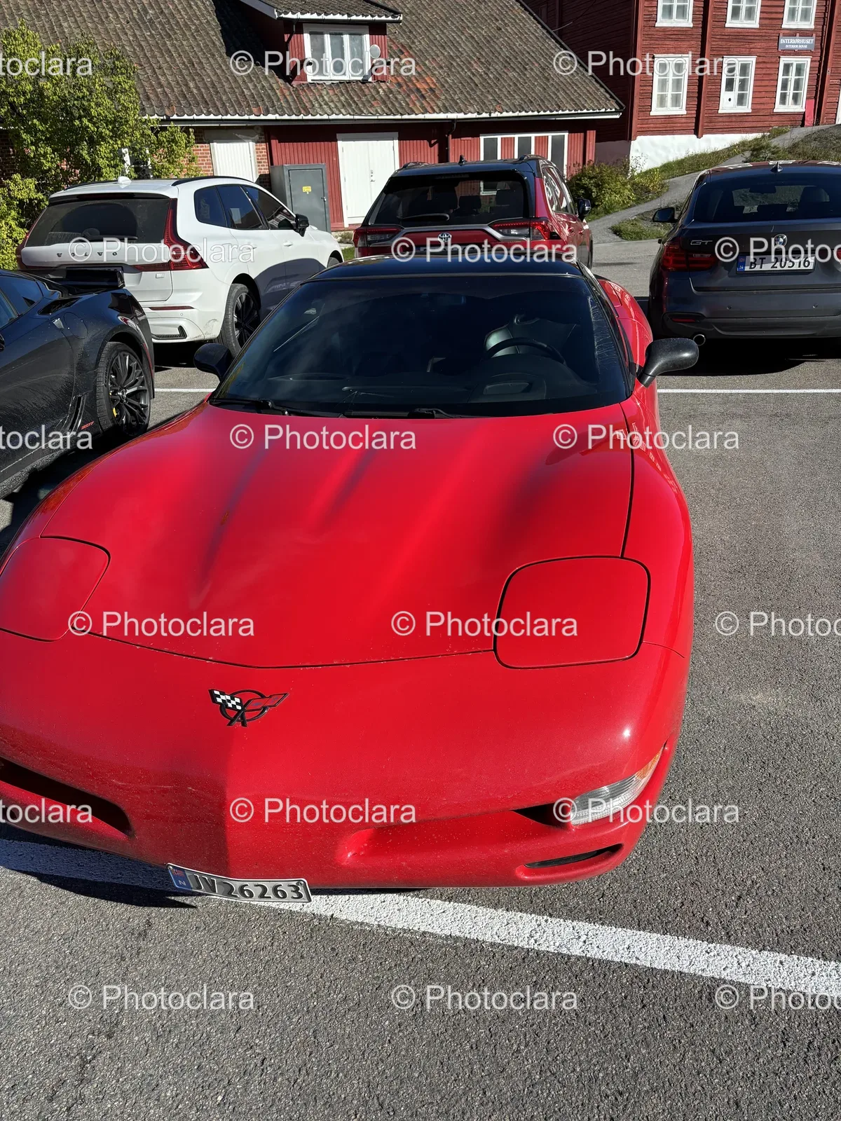Red-Sports-Car-in-Parking-Lot.jpg