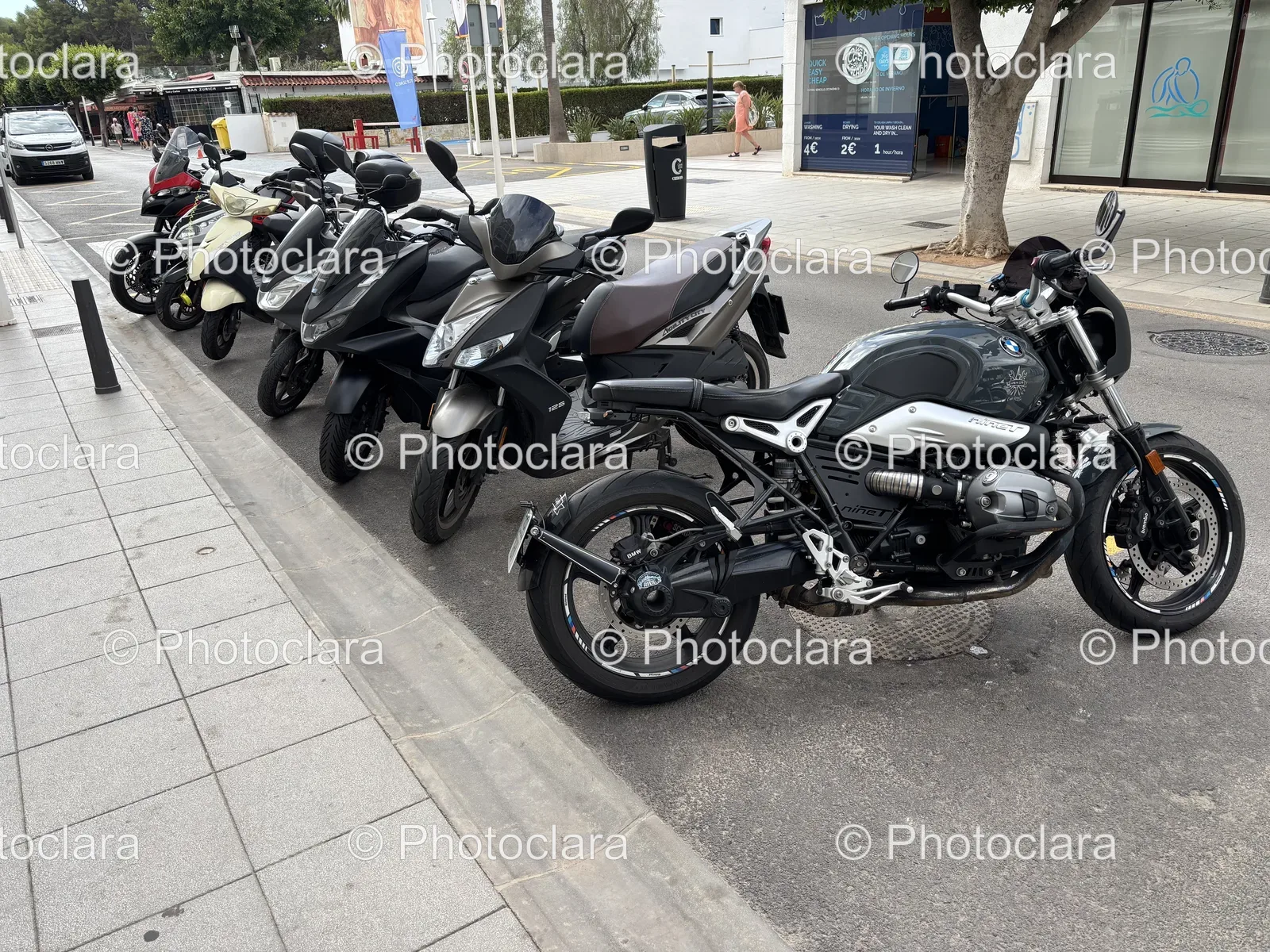Row-of-Motorcycles-Parked-on-the-Side-of-a-Road.jpg