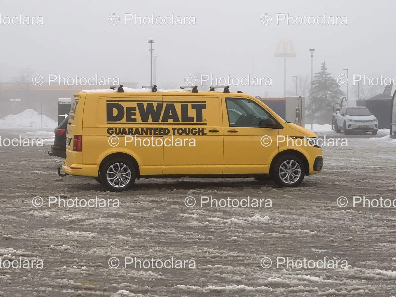 Yellow-Van-Parked-Snow-Covered-Lot.jpg