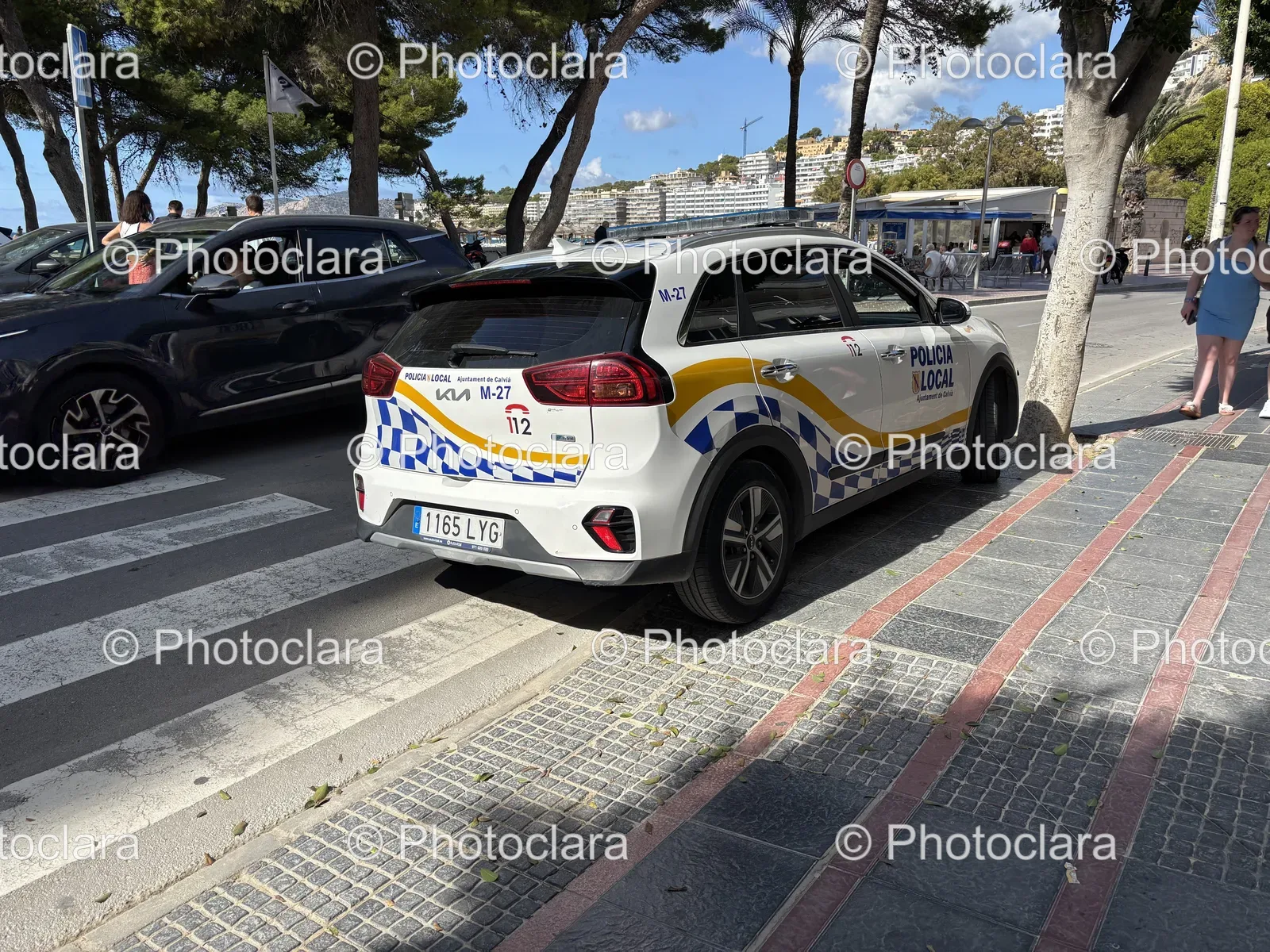 White-Police-Car-on-Urban-Street.jpg