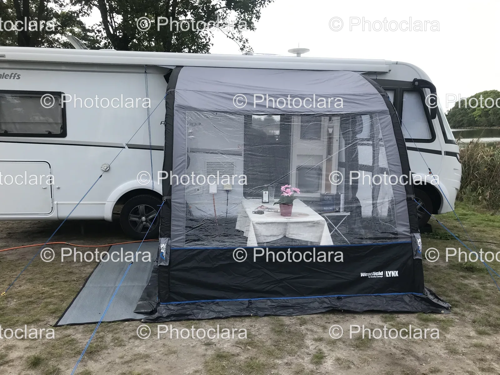 tent-in-front-of-a-white-rv.jpg