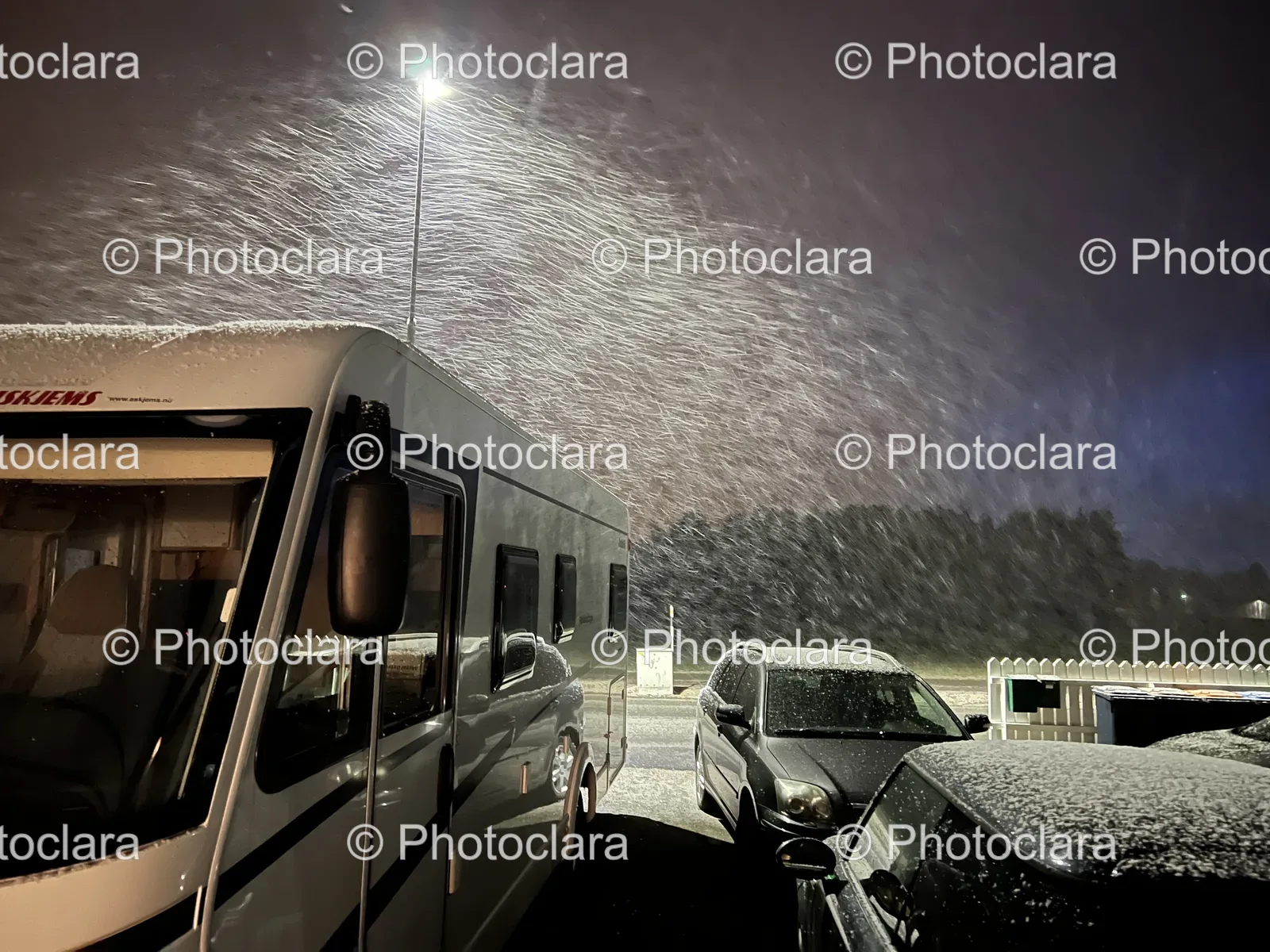 white-rv-cars-parking-lot-night-winter.jpg