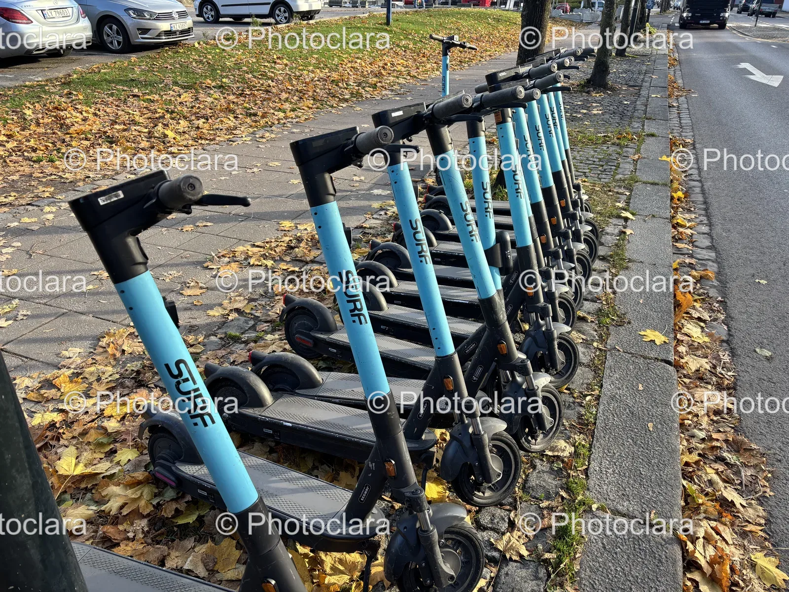 A-Row-of-Scooters-on-a-Sidewalk.jpg