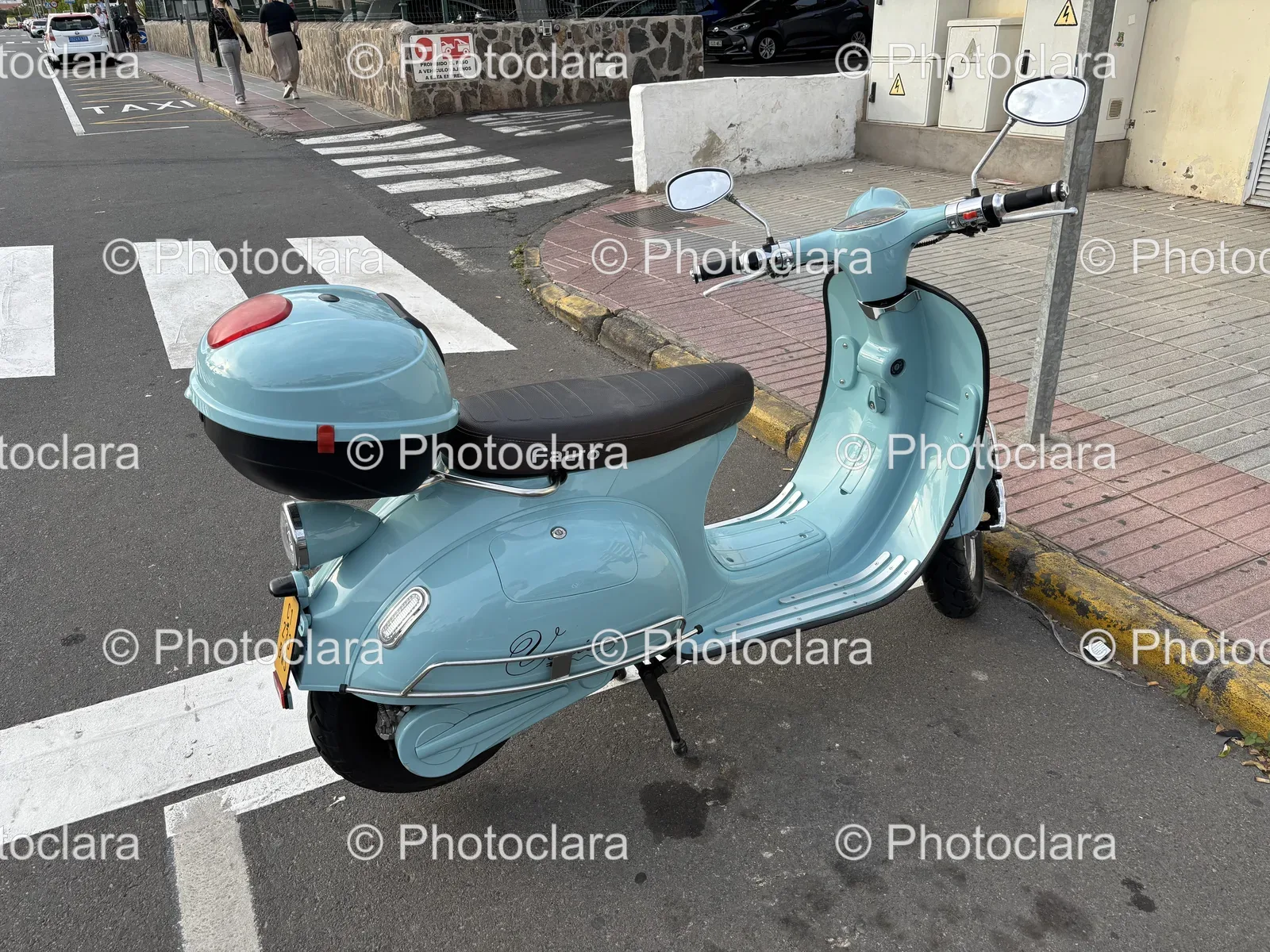 Light-Blue-Scooter-on-Urban-Street.jpg