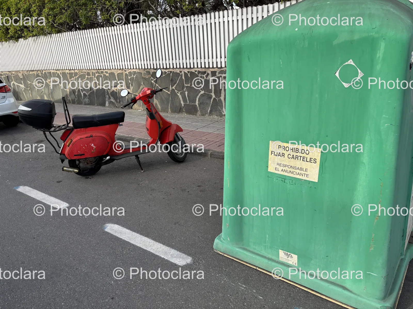 Red-Scooter-Parked-Next-to-Green-Container.jpg