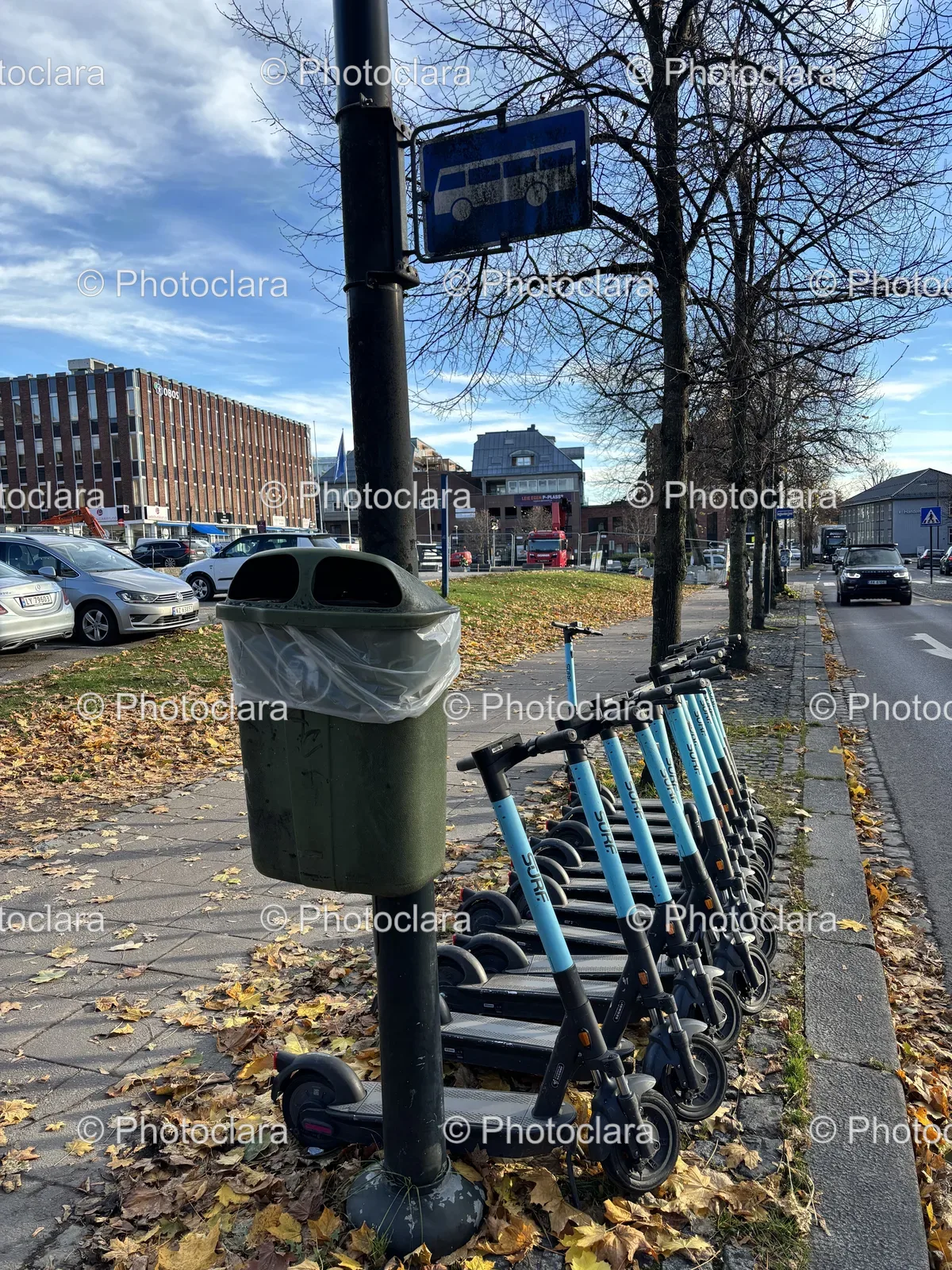 Urban-Scooters-Lined-Up-on-Sidewalk.jpg