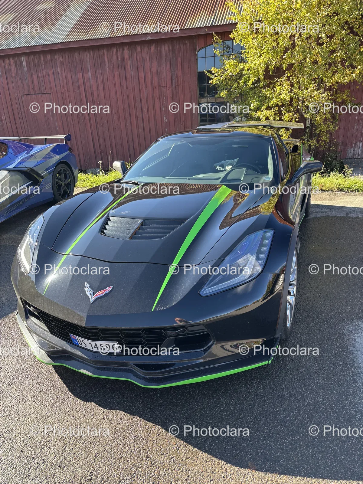 Black-Sports-Car-Green-Stripes-Parking-Lot.jpg