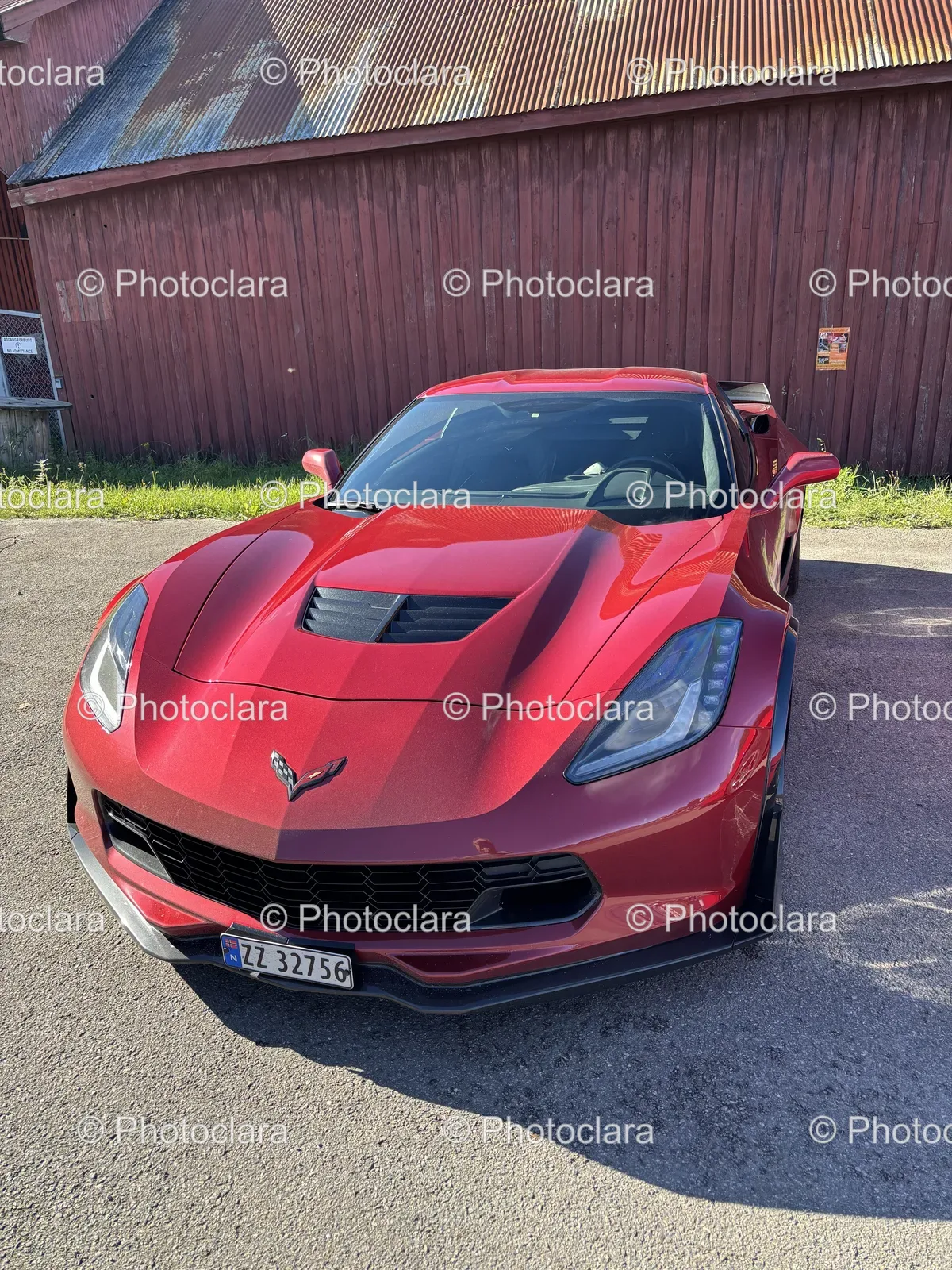 Red-Sports-Car-Parked-in-Front-of-Building.jpg