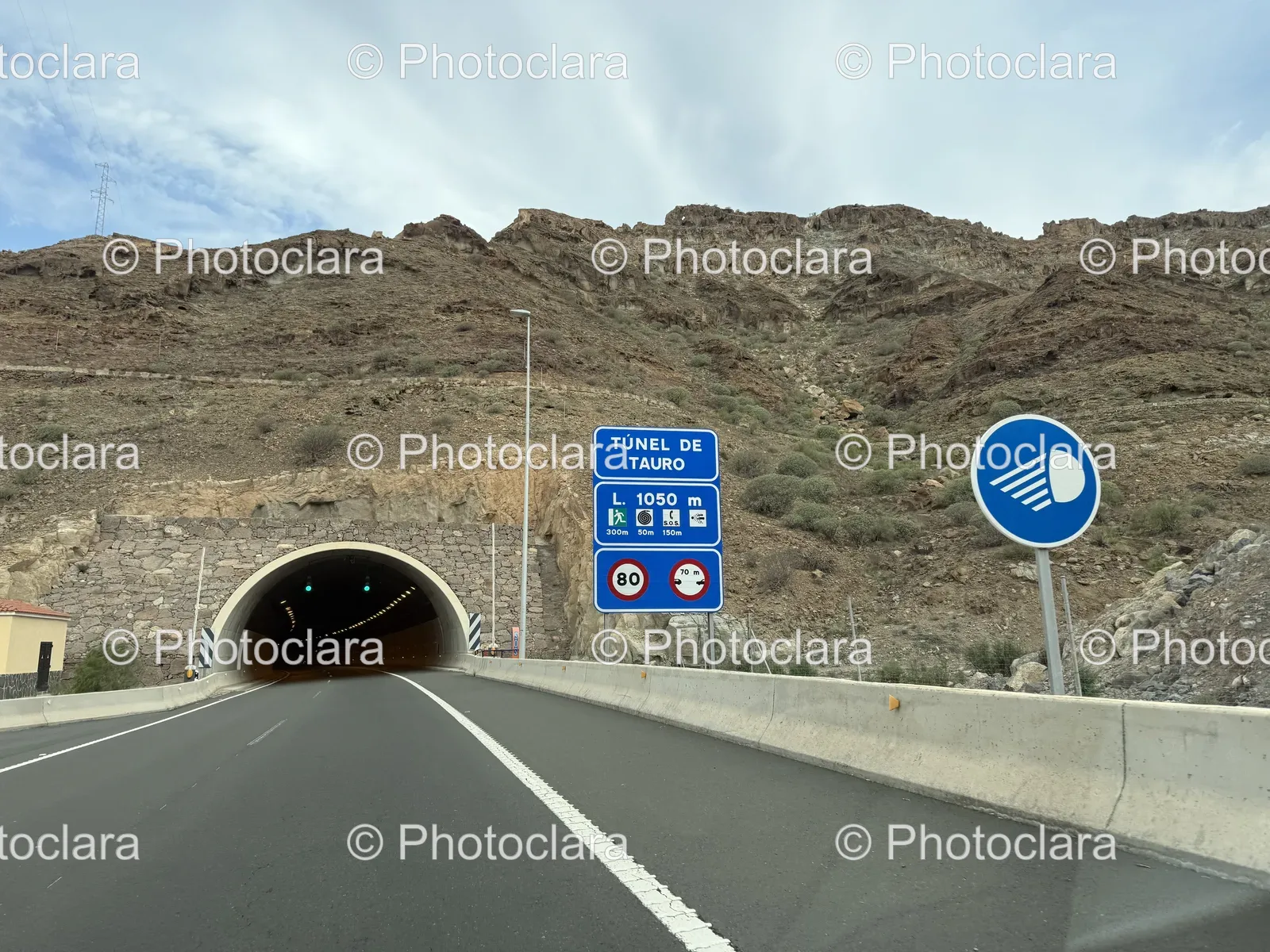 Tunnel-Road-with-Multiple-Signs.jpg