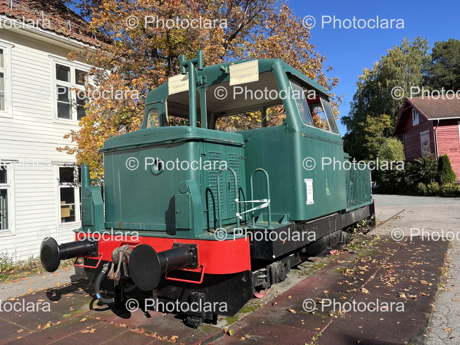 Green-Train-on-Sidewalk-with-Prohibited-Sign.jpg