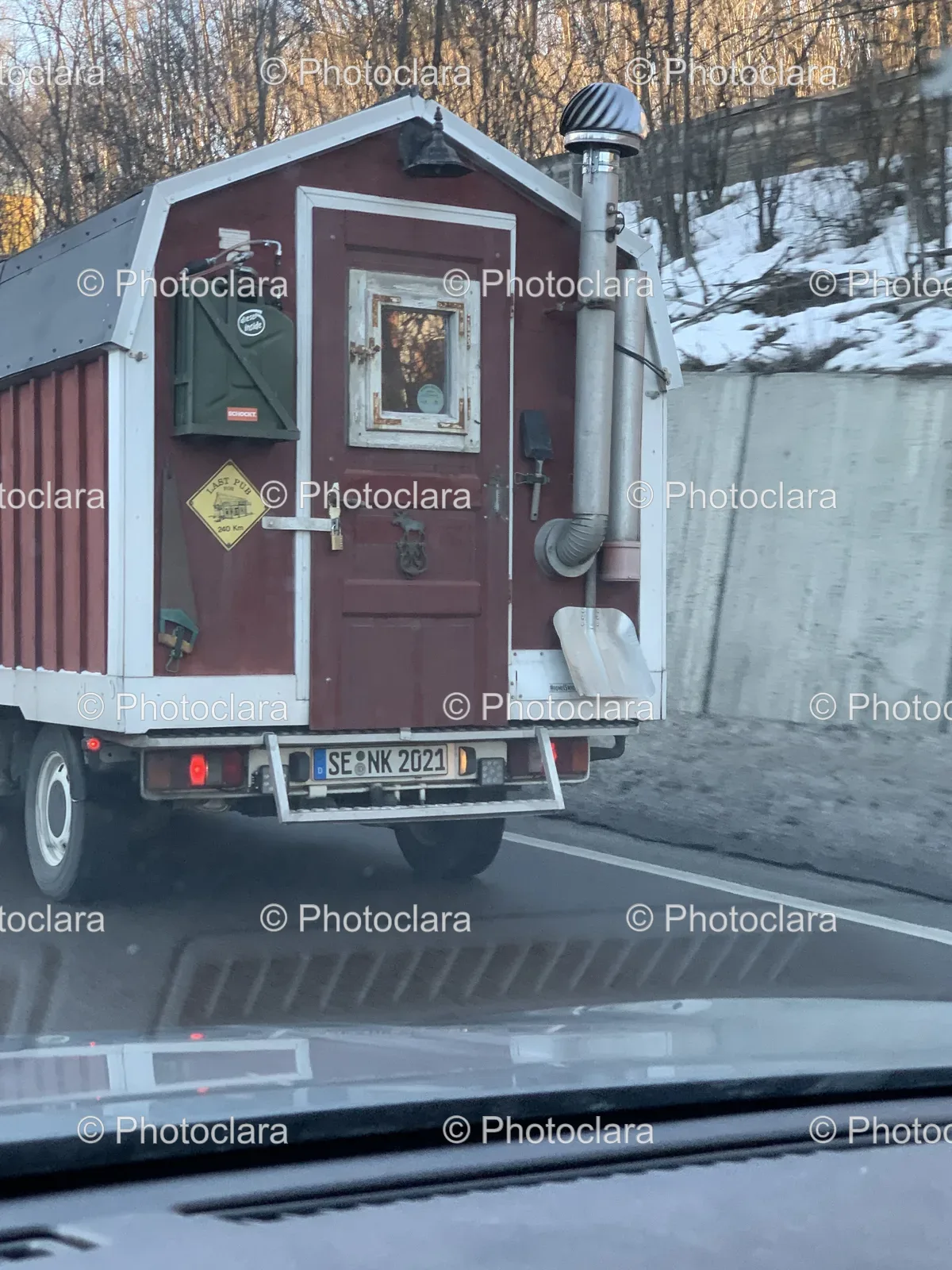 Red-and-White-Truck-on-a-Road.jpg