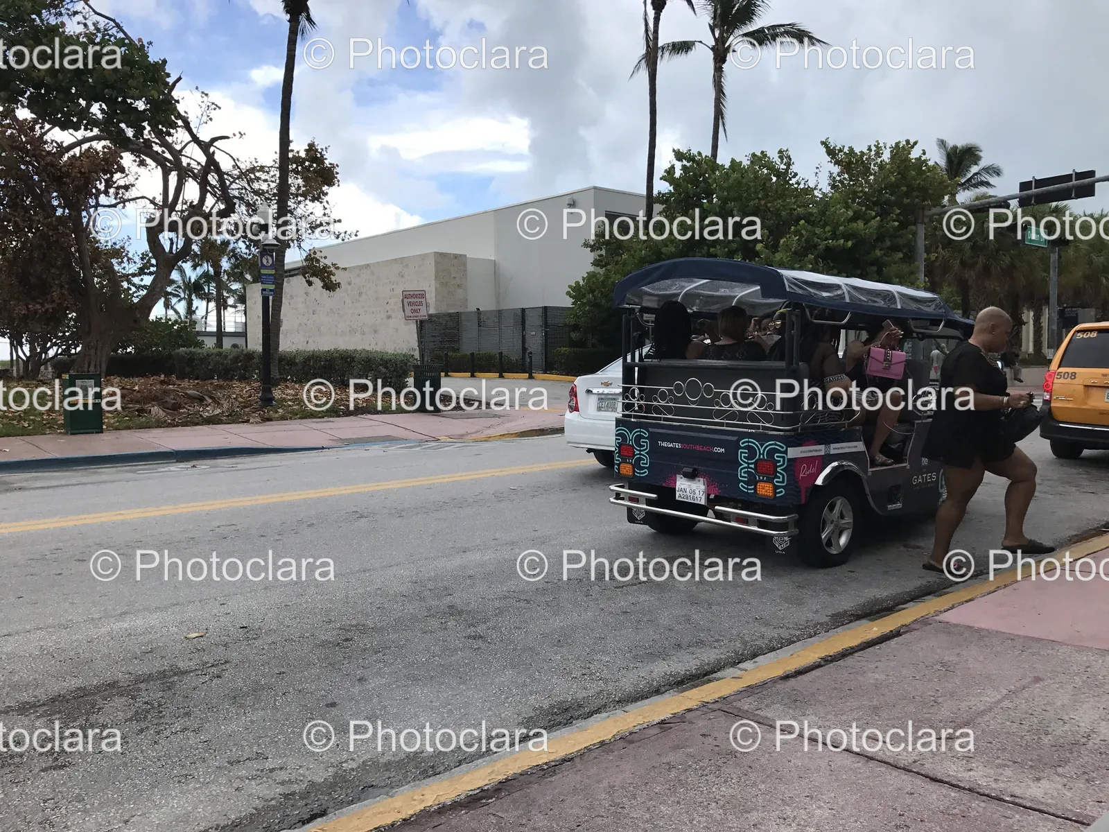 Group-of-People-in-a-Street-Vehicle.jpg