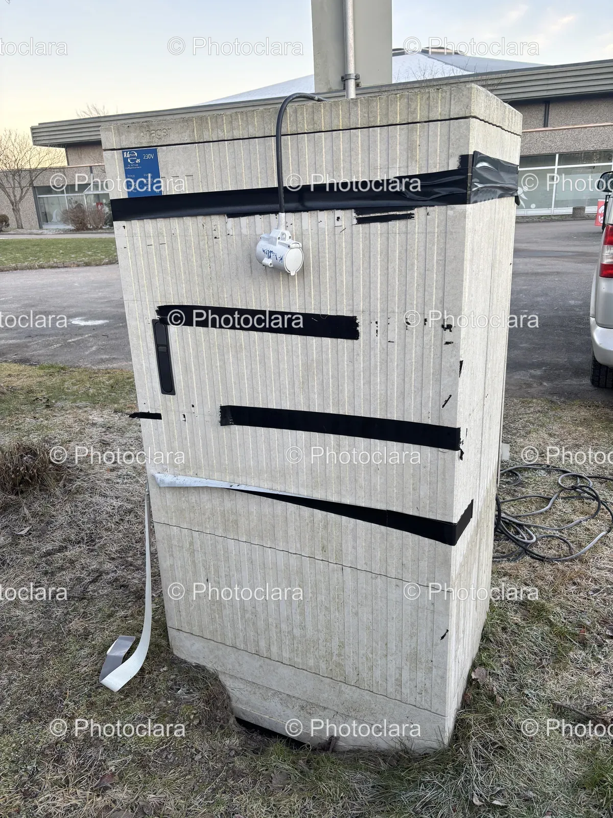 discarded-waste-container-next-to-vehicle.jpg